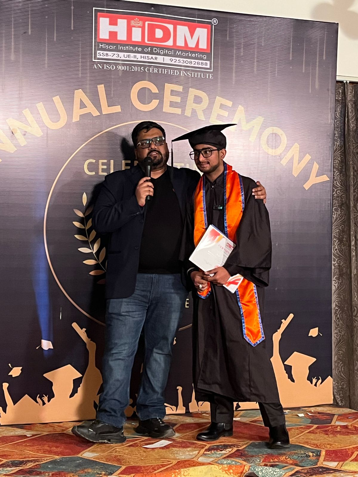 Student celebrating success with HIDM certificate