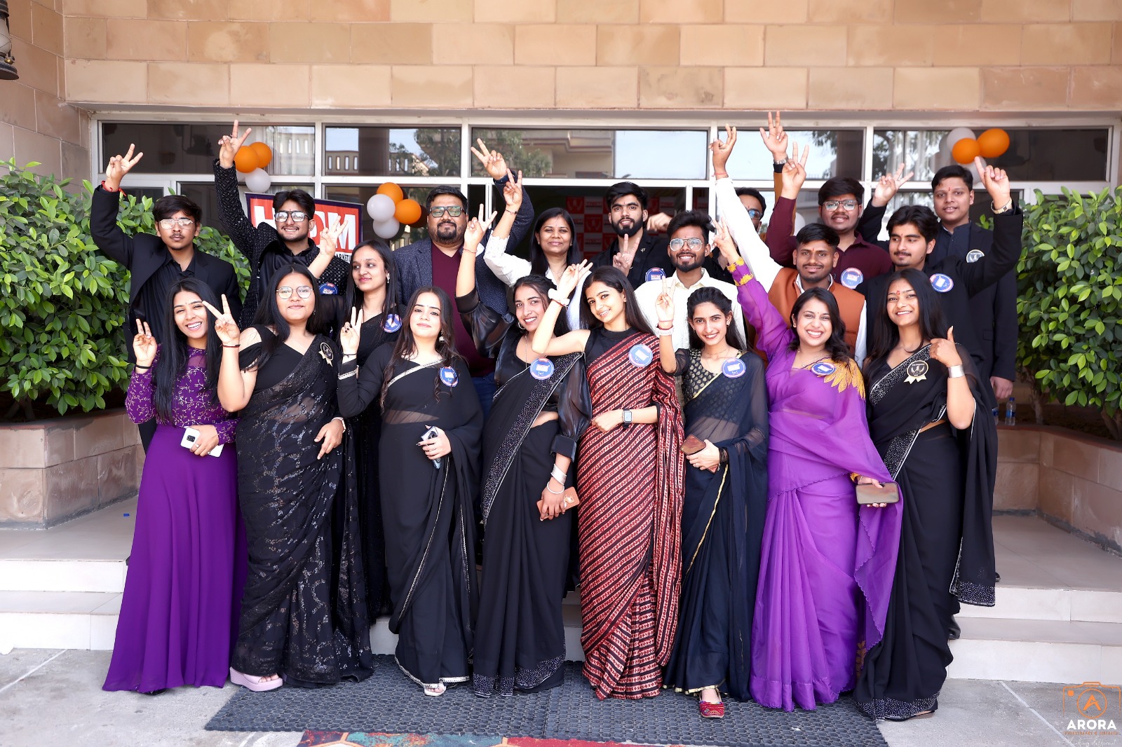 HIDM attendees posing together after a successful anniversary event.