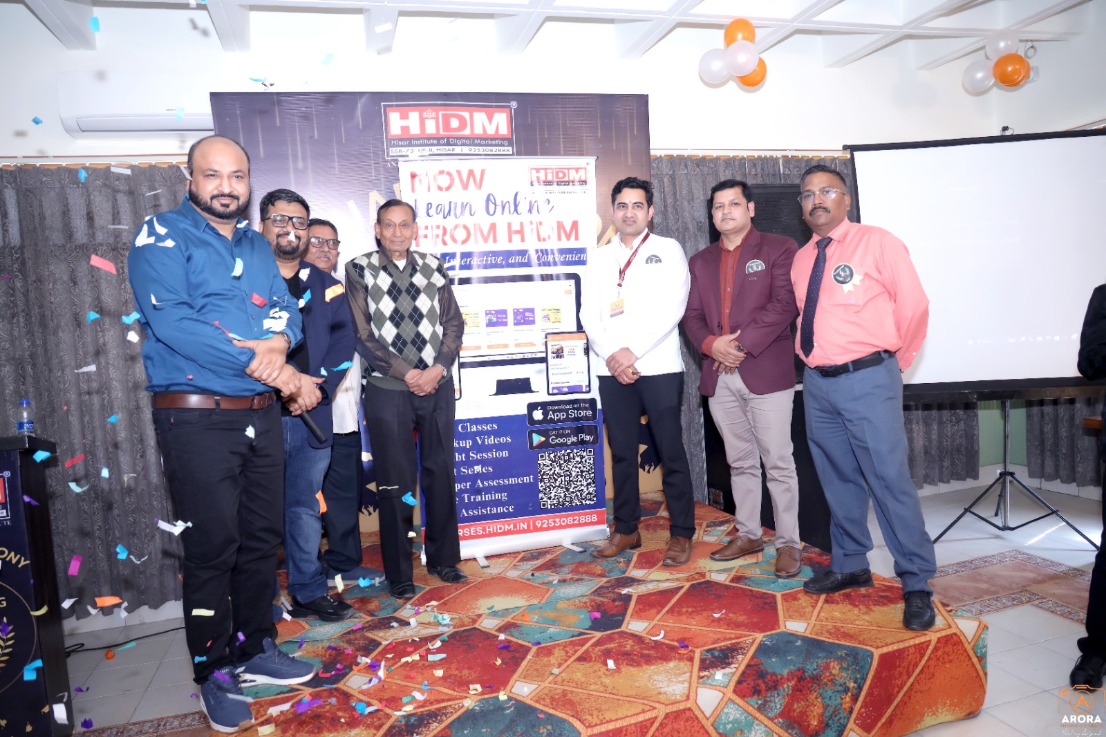 HIDM app launch event – Students and faculty celebrating the 6th anniversary of Hisar Institute of Digital Marketing with live music and awards ceremony.