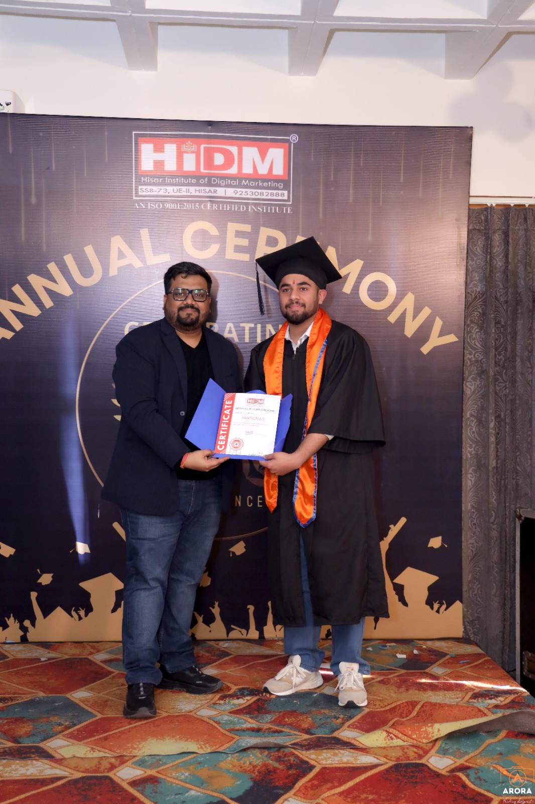 Student beaming with pride after receiving HIDM certificate.