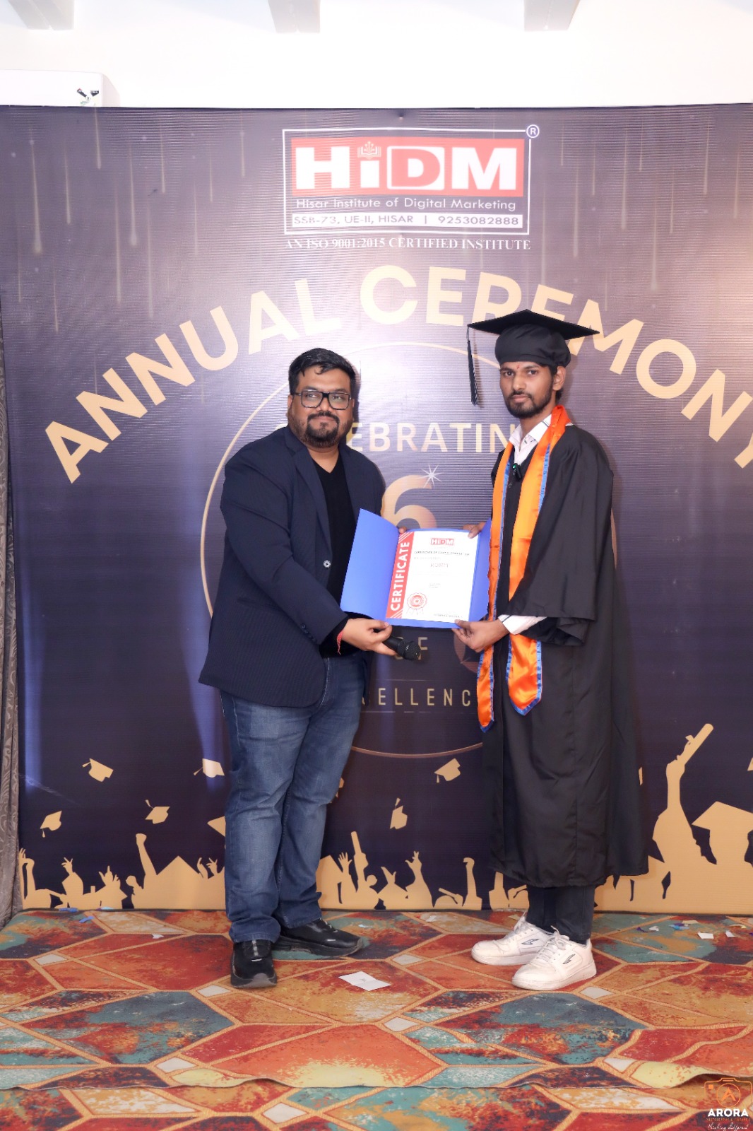 Student proudly displaying HIDM course completion certificate.