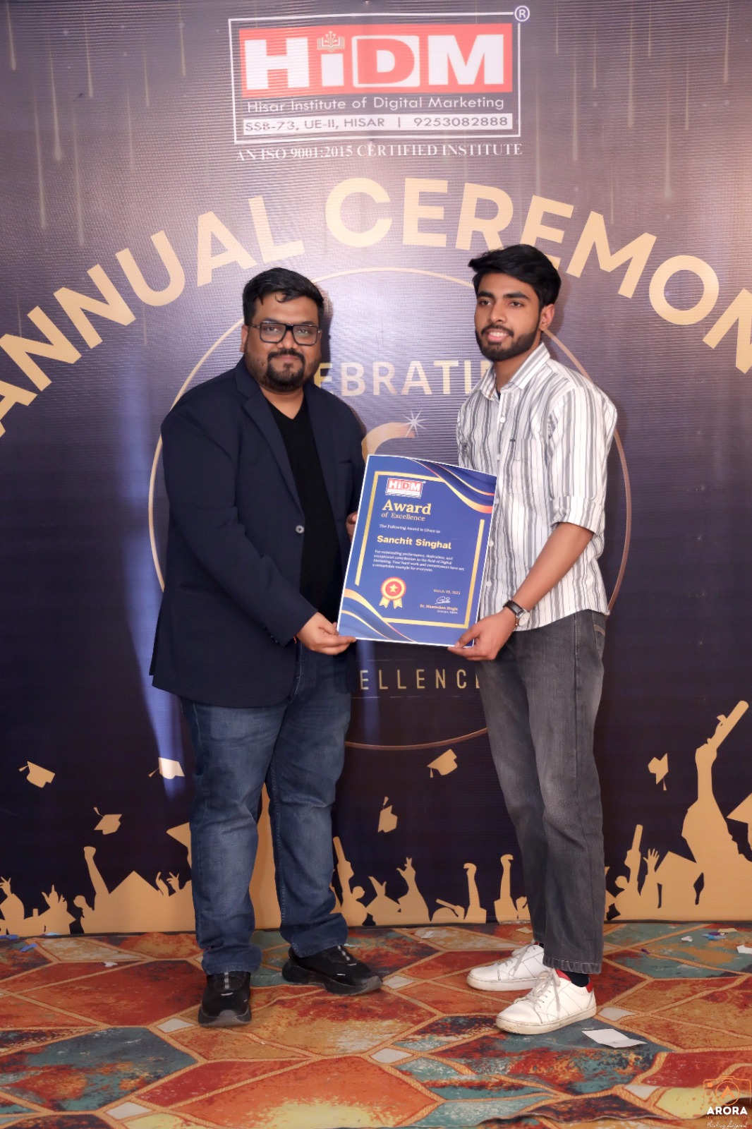 HIDM student smiling with Digital Marketing Excellence Certificate in hand.