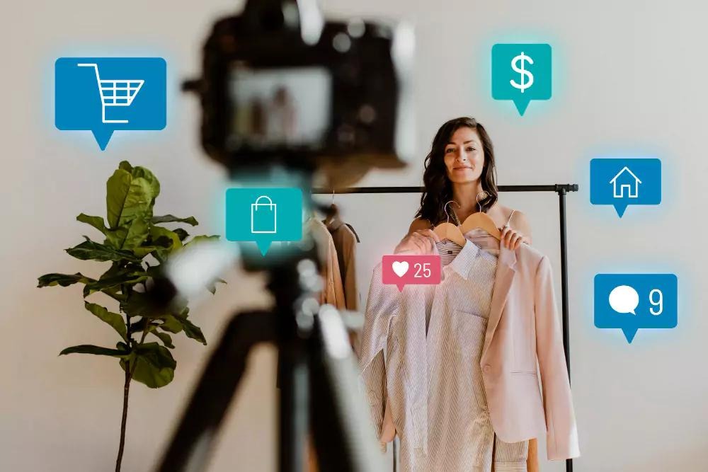 Fashion influencer creating online shopping content with social media engagement icons, showcasing digital marketing and e-commerce in the fashion industry.