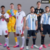England and Argentina national football team players stand together in their official kits before an international football match, with goalkeepers and star players posing for a promotional photo.