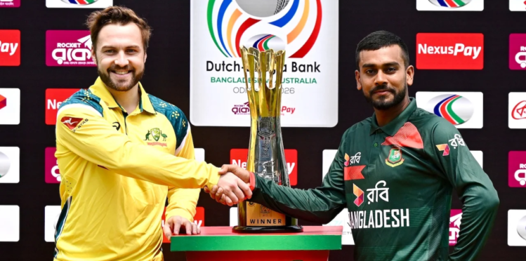 Bangladesh and Australia captains shake hands beside the Test series trophy