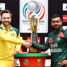 Bangladesh and Australia captains shake hands beside the Test series trophy